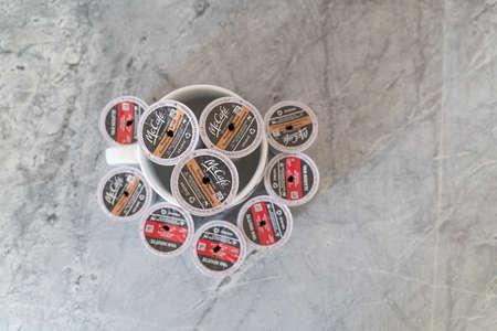 9 January 2022 - Calgary Alberta Canada - Used coffee pods with coffee mug