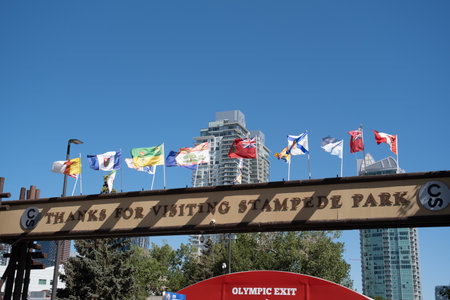 13 July 2022 - Calgary, Alberta Canada - Flags at Entrance to the calgary stampedeのeditorial素材