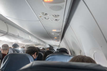 Passengers on airline flight for holiday travelの写真素材