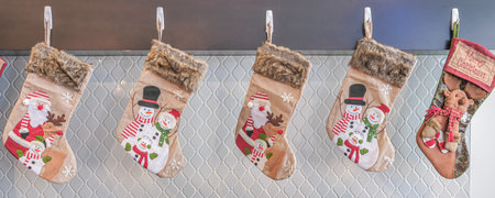 Christmas gift sock hanging over a fireplace