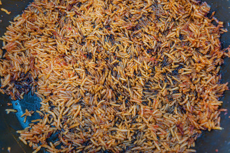 Burnt Nigerian smoky Jollof at the bottom of a pot