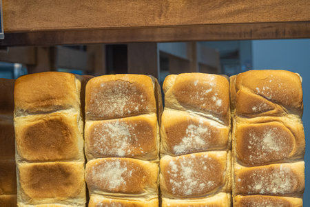Loaves of bread on display in bakeryの写真素材