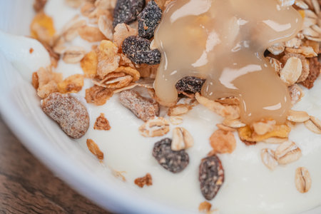 Organic fresh honey with cereal for breakfastの写真素材