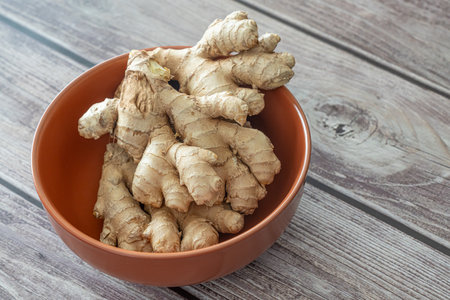 Fresh organic ginger roots rhizome on displayの写真素材