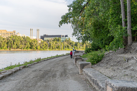 Couple walking beside a river for exerciseの写真素材
