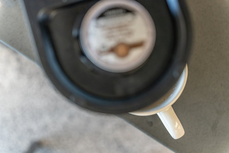 Coffee maker machine with coffee mug at officeのeditorial素材