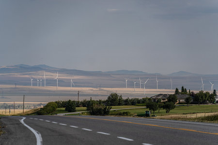 windfarm wind turbines rural farm area to create clean energy