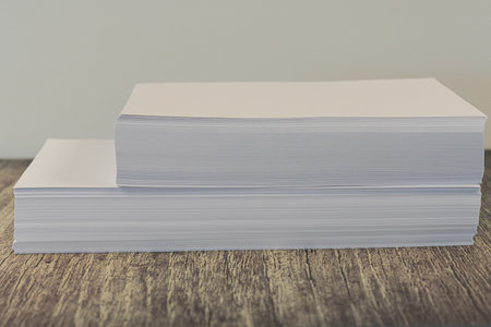 Piles of Legal and letter sized blank printing paper
