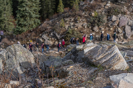 People hiking a mountain trail in the Banff National Parkの写真素材
