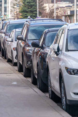 Cars parked at roadside in city downtownの写真素材