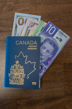 New Canadian Passport with Canadian and US Dollars bank notesの写真素材