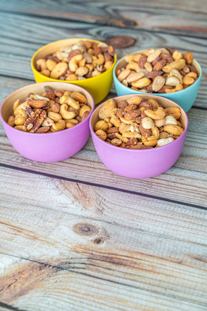 Bowls of assorted nuts ready to eatの写真素材