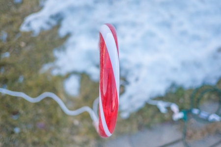 Christmas Candy cane ornaments on house drivewayの写真素材