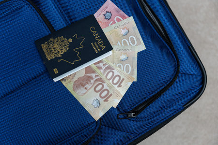 Luggage with Passport and Canadian Dollar Bank notes