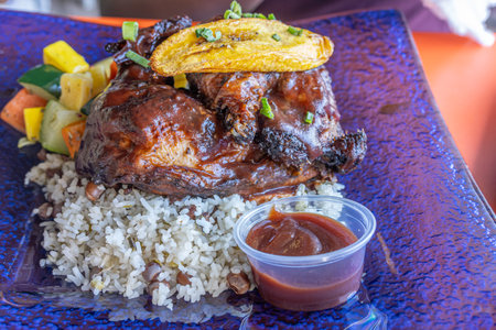 A Plate of Jerk Chicken with Rice and Beansの写真素材