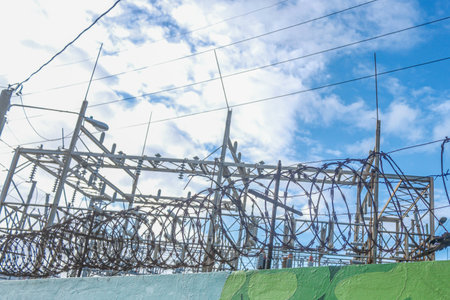 Power station protected by barbed wire fenceの写真素材