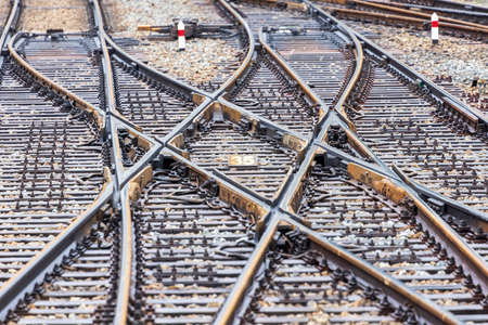 Tracks crisscross at train junction close upの写真素材