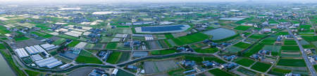 Aerial panorama: Rice fields and water storage ponds in countryside