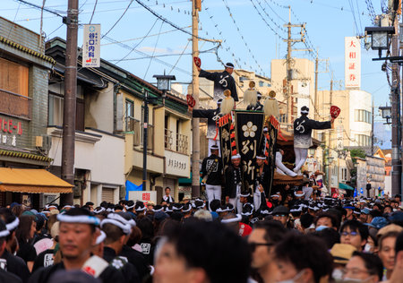 Kishiwada, Japan - September 17, 2023: Portable shrine on crowded street in residential neighborhoodのeditorial素材