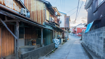 Narrow road between old houses in small town Japan