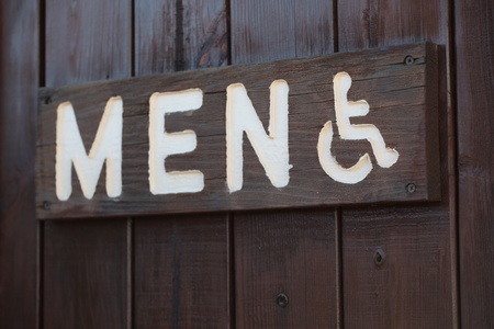 Men's restroom sign in a public park