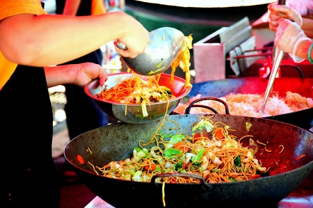 Chinese stir fry cooking at a outdoor event.