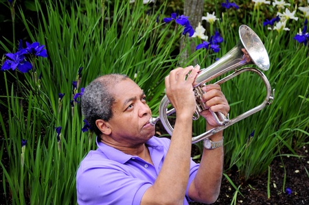 African american jazz musician playing his flugelhorn.の写真素材