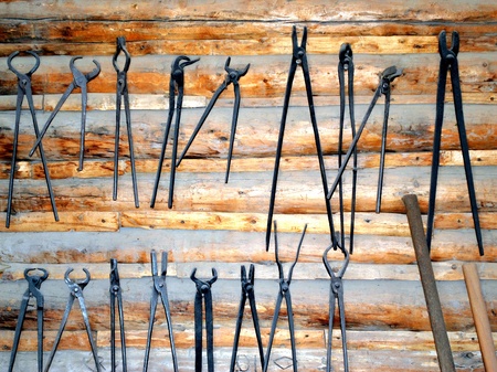 Blacksmith tools displayed indoors.の写真素材