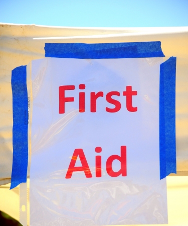 First aid station banner displayed outdoors の写真素材