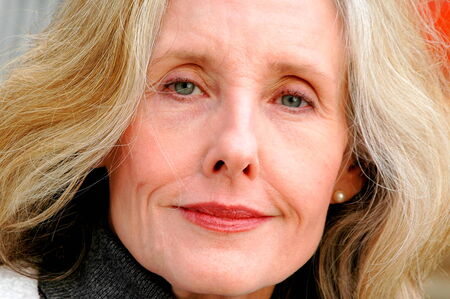 Mature female blond beauty expressions indoors の写真素材