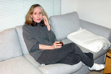 Mature female beauty relaxing at home.の写真素材