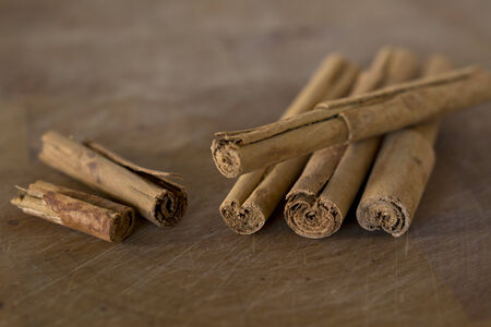 Cinnamon sticks on a woodenの写真素材