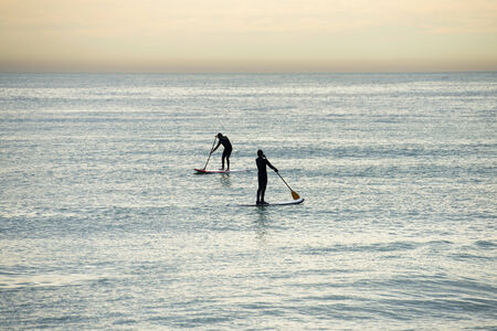 Paddle surf on the beachの写真素材