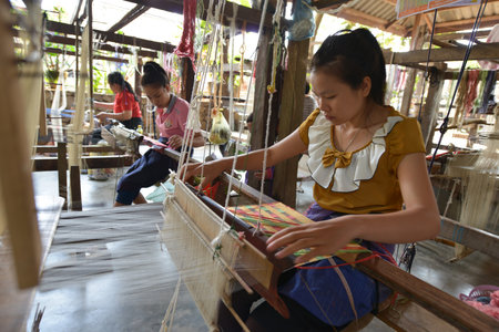 Luang Prabang, Laos  Unidentified woman worker in silk production factory on March 1, 2014 in Luang Prabang, Laosのeditorial素材