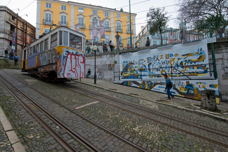LISBON, PORTUGAL - JANUARY 23: Traditional Tram Through the streets of Lisbon on January 23, 2016 in Lisbon, Portugal. The Lisbon tramway network Operates since 1873.のeditorial素材