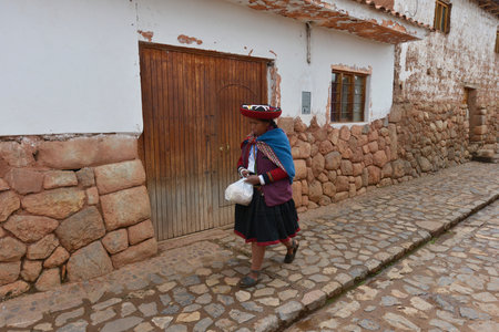 CHINCHERO, PERU - SEPTEMBER 20: Unidentified woman with the traditional clothes walking in Chinchero on September 20, 2015 in Peruのeditorial素材