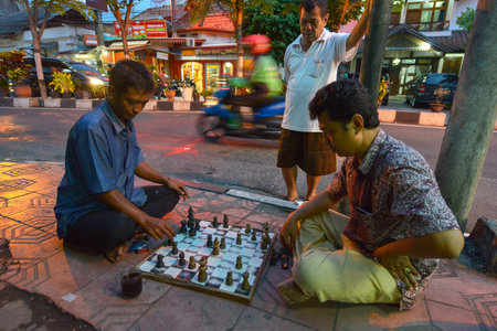 Yogyakarta, Java, Indonesia - August 6: Unidentified men playing chess on the street on August 6, 2016 in Yogyakarta, Java, Indonesia.のeditorial素材