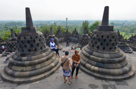 Yogyakarta, Java, Indonesia - August 7: Tourists visiting the Buddhist temple of Borobudur on August 7, 2016 in Yogyakarta, Java, Indonesiaのeditorial素材