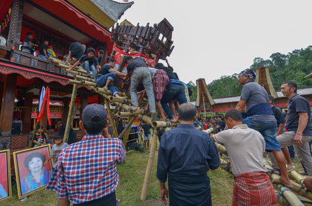 Tana Toraja, Sulawesi, Indonesia - August 15: Funeral ceremony on August 15, 2016 in Tana Toraja, Sulawesi, Indonesia. In Tana Toraja the funeral ritual is The most elaborate and expensive evenのeditorial素材