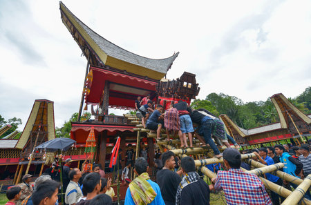 Tana Toraja, Sulawesi, Indonesia - August 15: Funeral ceremony on August 15, 2016 in Tana Toraja, Sulawesi, Indonesia. In Tana Toraja the funeral ritual is The most elaborate and expensive evenのeditorial素材