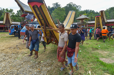 Tana Toraja, Sulawesi, Indonesia - August 15: Funeral ceremony on August 15, 2016 in Tana Toraja, Sulawesi, Indonesia. In Tana Toraja the funeral ritual is The most elaborate and expensive evenのeditorial素材