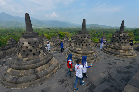 Yogyakarta, Java, Indonesia - August 7: Tourists visiting the Buddhist temple of Borobudur on August 7, 2016 in Yogyakarta, Java, Indonesiaのeditorial素材