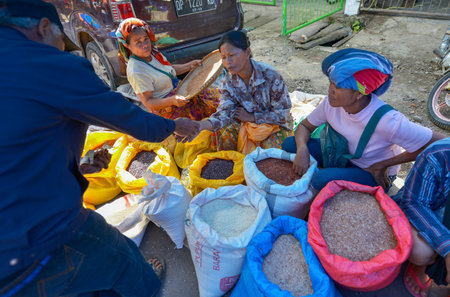 Rantepao, Tana Toraja, Sulawesi, Indonesia - August 16: Sellers of vegetables in the market Pasar Bolu on August 16, 2016 in Rantepao, Tana Toraja, Sulawesi, Indonesiaのeditorial素材