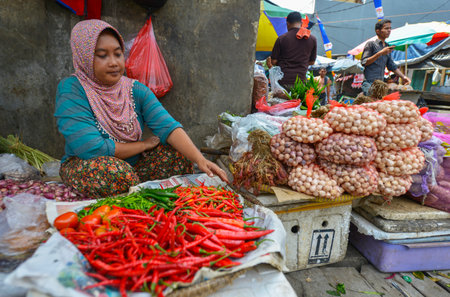 JAKARTA, JAVA, INDONESIA - AUGUST 25: An unidentified woman selling food at a Jakarta market on August 25, 2016 in Java, Indonesiaのeditorial素材