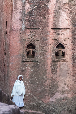 Lalibela, Ethiopia - January 6: Portrait of an unidentified woman in Bet Mikael, one of the churches excavated in the rock of Lalibela on January 6, 2018 in Lalibela, Ethiopia.のeditorial素材