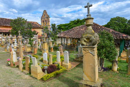 Barichara, Colombia - August 11: Tombstones in the cemetery, contains many ornate gravestones in yellow stone that is available in plenty in the local area on August 11, 2017 in Barichara, Colombia.のeditorial素材