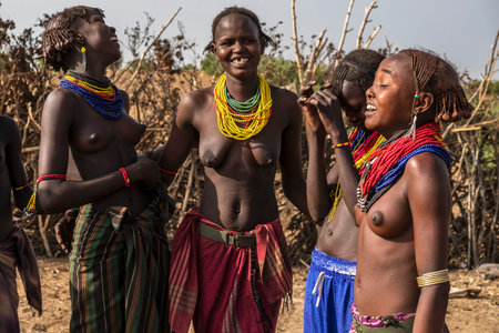 Omorate, Ethiopia - January 25: Unidentified women from Dassanech tribe posing for a portrait in their village near the Omorate river on January 25, 2018 in Omorate, Ethiopia.のeditorial素材