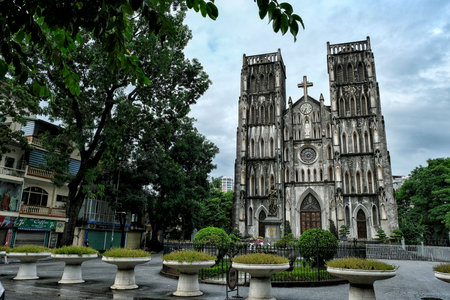 HANOI, VIETNAM - AUGUST 31: People walking near the Saint Joseph Cathedral on August 31, 2018 in Hanoi, Vietnam.のeditorial素材