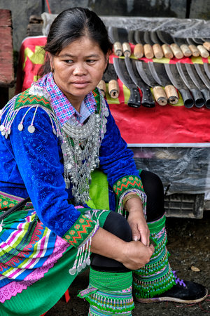 Sapa, Vietnam - August 24: Hmong women selling knives at the market on August 24, 2018 in Sapa, Vietnam.のeditorial素材