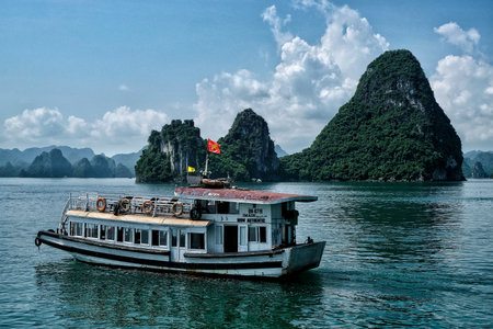 Halong, Vietnam - August 22: Tourists visiting Halong Bay by boat on August 22, 2018 in Halong, Vietnam.のeditorial素材